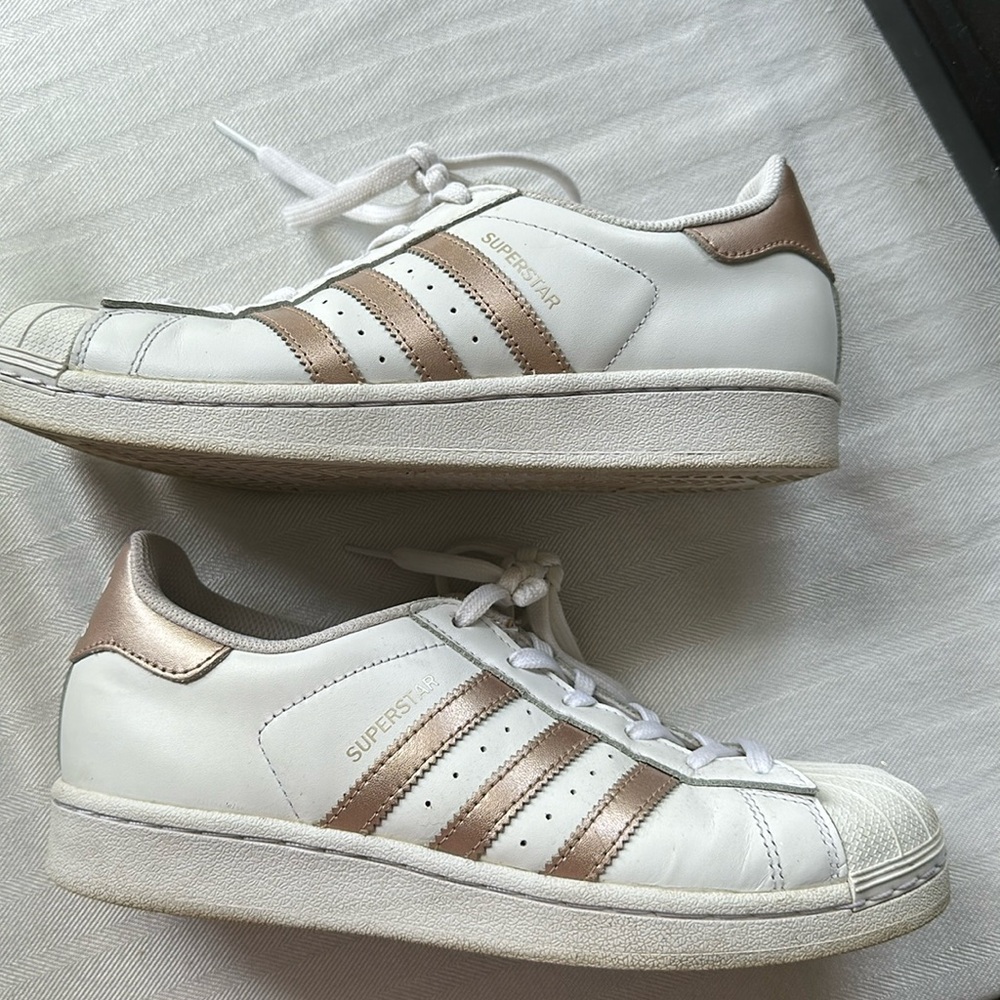 Adidas Women Superstar Sneakers with gold three stripes